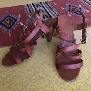 saucy pair of cognac leather cross-strap heels